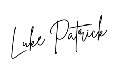 Signature of Luke Patrick in green ink.