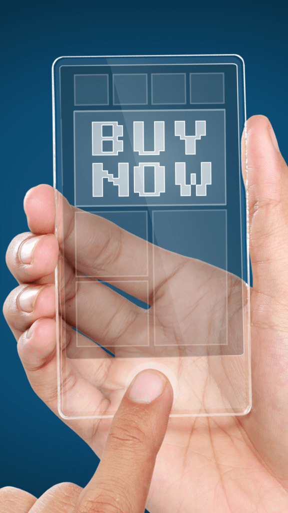 Hand holding transparent 'Buy Now' digital card