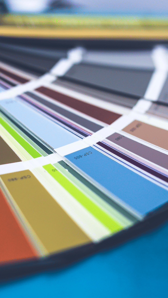 Colorful fan of paint swatches with blurred background